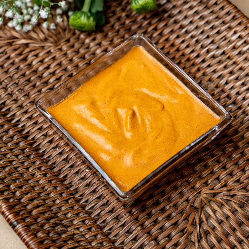 Vegan flavored butter infused with harissa, a spicy and aromatic dairy-free spread